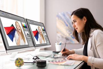 A graphic designer at work in a vibrant studio, us